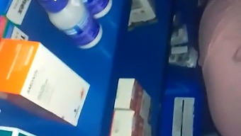 Intimate Encounter In A Pharmacy Amidst Various Medications